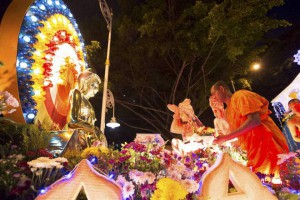 Buddhists monk put offerings from devotees on a Buddha statue during Wesak Day parades, also known as Buddha's birthday, in Kuala Lumpur, Malaysia, on May 3, 2015. Vesak Day, one of the holiest days for Buddhists, offers an opportunity for all followers to come together and celebrate not only Buddha's birthday, but also his enlightenment and achievement of nirvana.