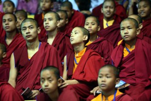 Young Buddhists listen to Indian Prime Minister Narendra Modi's speech during International Buddha Poornima Diwas celebrations in New Delhi on May 4, 2015. Vesak, also known as Buddha Purnima is on a full moon day and marks the birth, enlightenment and 'parinirvana' or passing away of the Buddha.