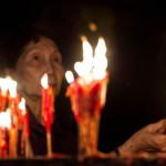 In this picture taken on May 10, 2015, a woman burns incense sticks at Joss House temple to celebrate the Tin Hau festival in Hong Kong.