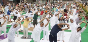 MLA KD Bhandari, mayor Sunil Jyoti, MLA Manoranjan Kalia and former Mayor Rakesh Rathore practise yoga to mark the International Yoga Day in Jalandhar on June 21, 2015