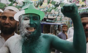 A man with a painted flag in Peshawar