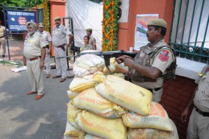 A policeman keeping vigil while standing behind a bunker at the entrance of Guru Nanak Stadium, the venue for the 69th Independence Day function in Ludhiana on Saturday.