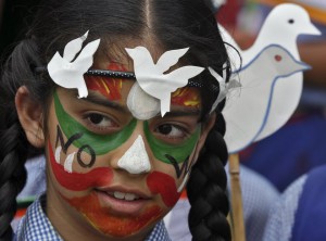 A student participates in a face-painting event to commemorate the 70th anniversary of the atomic bombings of the Japanese cities of Hiroshima and Nagasaki, at a school in Chandigarh, India, on August 6, 2015.