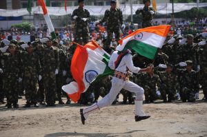 A student running during the Independence Day function at Mini Stadium parade ground in Jammu