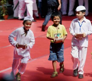 Children rejoice after receiving sweets during the 70th Independence Day celebrations at AICC headquarters in New Delhi