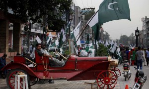 People celebrate the country's upcoming 69th Independence Day in Rawalpindi, Pakistan