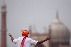 Prime Minister Narendra Modi gestures as he addresses the nation from the historic Red Fort during Independence Day celebrations in Delhi.