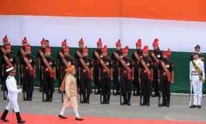 Prime Minister Narendra Modi (C) inspects an honour guard of troops after delivering his Independence Day speech from The Red Fort in New Delhi on August 15, 2015. Modi warned that corruption was eating away at India