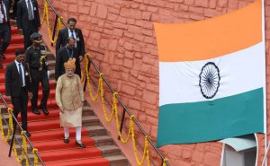 Prime Minister Narendra Modi (C) walks with officials after delivering his Independence Day speech from The Red Fort in New Delhi on August 15, 2015