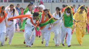 School students in a jubilant mood after their performance during the 69th Independence Day function at Guru Nanak Stadium in Ludhiana