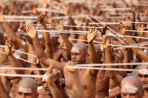 Newly initiated Naga Sadhus or Hindu holy men of the Juna Akhara attend the Dikasha ritual on the banks of the river Ganges during the ongoing ‘Kumbh Mela’, in Prayagraj