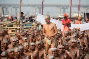 Newly initiated Naga Sadhus (Hindu holy men) gather as they perform rituals on the banks of the Ganga river during the Kumbh Mela, in Allahabad on February 6.