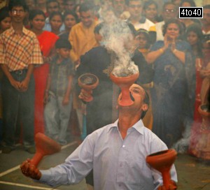 A devotee performing Dhunuchi Naach at Durga Puja Pavilion in Gurgaon