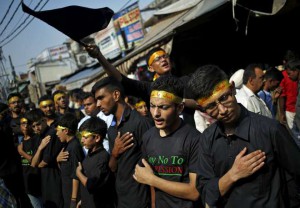 Shi'ite Muslim mourners beat their chests during a Muharram procession to mark Ashura in Delhi on October 24, 2015