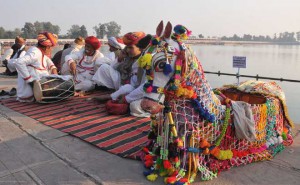 Artistes from Rajasthan rest after a performance during ‘Gita Jayanti Mahotsav’ in Kurukshetra on December 21, 2015