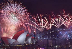 Fireworks light up the sky over Sydney's Opera House (L) and Harbour Bridge during New Year celebrations in Sydney on January 1, 2016