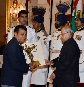 President Pranab Mukherjee presents Dronacharya award to gymnastics coach Bishweshwar Nandi at the National Sports and Adventure Award 2016 function at Rashtrapati Bhawan in New Delhi on August 29, 2016.