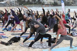 Participants strike a pose during an event to mark International Yoga Day, at Bondi Beach in Sydney, Australia.