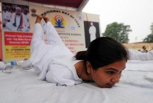 People doing yoga at M A Stadium, in Jammu