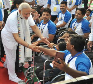 Prime Minister Narendra Modi greets participants on the occasion of the 2nd International Day of Yoga at the Capitol Complex in Chandigarh