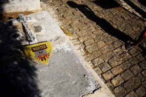 A kite lies on a grave in a cemetery in the Vila Operaria Favela of Rio de Janeiro, Brazil.