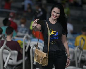 A ceremony attendee takes a selfie prior to the opening ceremony of the Rio 2016 Olympic Games at the Maracana stadium in Rio de Janeiro on August 5, 2016.