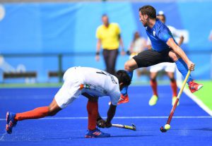 Argentina’s Lucas Vila jumps as India’s Harmanpreet Singh hits the ball during the mens field hockey Argentina vs India match of the Rio 2016 Olympics Games at the Olympic Hockey Centre in Rio de Janeiro on August 9 2016.