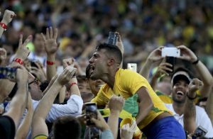 Brazil’s Rafinha celebrates his team’s win over Germany in their gold medal men’s football match at the Maracana stadium in Rio de Janeiro on August 20, 2016