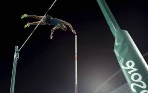 Brazil’s Thiago Da Silva makes the attempt, setting a new Olympic record, to win the gold medal in the Men’s Pole vault final, during the athletics competitions of the 2016 Summer Olympics at the Olympic stadium in Rio de Janeiro, Brazil, on August 15, 2016.