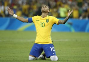 Brazil’s forward Neymar celebrates scoring the winning goal during the penalty shoot-out of the Rio 2016 Olympic Games men’s football gold medal match between Brazil and Germany at the Maracana stadium in Rio de Janeiro on August 20, 2016