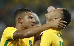 Brazil’s forward Neymar (R) celebrates scoring the winning goal during the penalty shoot-out of the Rio 2016 Olympic Games men’s football gold medal match between Brazil and Germany at the Maracana stadium in Rio de Janeiro on August 20, 2016