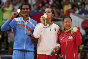 Gold medallist Carolina Marin of Spain, silver medallist PV Sindhu of India and bronze medallist Nozomi Okuhara of Japan pose together at the Riocentro stadium in Rio de Janeiro on August 19, 2016.