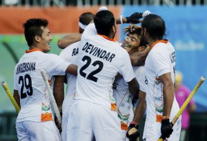 India’s Kothajit Singh Khadangbam (2R) celebrates with his teammates after scoring a goal during the men’s field hockey Argentina vs India match of the Rio 2016 Olympics Games at the Olympic Hockey Centre in Rio de Janeiro on August 9, 2016.