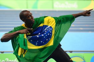 Jamaica’s Usain Bolt celebrates his team’s victory at the end of the Mens 4x100m Relay Final during the athletics event at the Rio 2016 Olympic Games at the Olympic Stadium in Rio de Janeiro