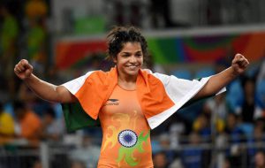 Sakshi Malik celebrates after winning bronze against Kyrgyzstan’s Aisuluu Tynybekova in the women’s wrestling freestyle 58kg