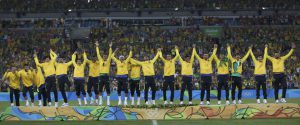 Team Brazil celebrate on the podium after they won gold medals for defeating Germany in Rio 2016 Olympic Games men’s football gold medal match between Brazil and Germany at the Maracana stadium in Rio de Janeiro on August 20, 2016