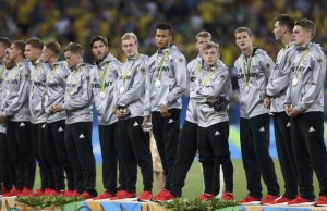 Team Germany react during the medal ceremony after losing to Brazil in Rio 2016 Olympic Games men’s football gold medal match between Brazil and Germany at the Maracana stadium in Rio de Janeiro on August 20, 2016