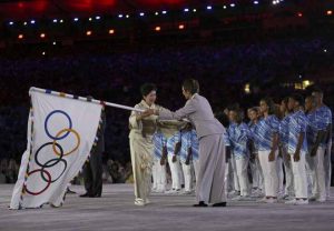 Tokyo governor Yuriko Koike takes the Olympic flag on stage during the closing ceremony of the Rio 2016 Olympic Games at the Maracana stadium in Rio de Janeiro on August 21, 2016