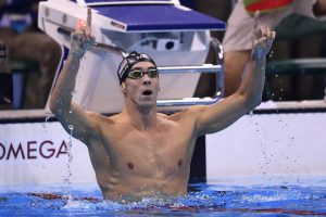 USA’s Michael Phelps celebrates after winning the Men’s 200m Butterfly Final during the swimming event at the Rio 2016 Olympic Games at the Olympic Aquatics Stadium in Rio de Janeiro on August 9, 2016.