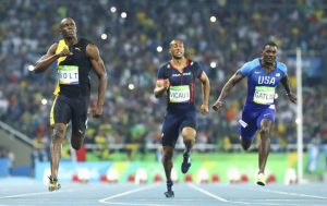 Usain Bolt of Jamaica (L) wins the gold. Justin Gatlin of USA (R) took the silver.