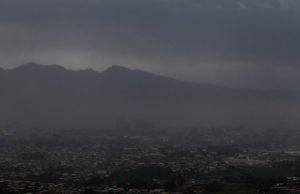 Ash from the Turrialba volcano falls on San Jose city after an eruption ...