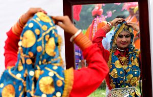 A participant getting ready for her performance during “Ratnawali” a state level Haryana Day celebration at Kurukshetra University, Kurukshetra.