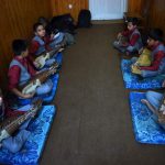 Afghan music students play the Robab during class at the Afghanistan National Institute of Music in Kabul.