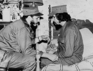 This 1959 file photo shows Cuban Fidel Castro (L), then 33 years old, chatting with ailing 31-year-old Ernesto ‘Che’ Guevara, at his barracks in Havana, shortly after both led the revolution that overthrew the Batista regime.