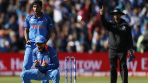 Bhuvneshwar Kumar (L) then gave India the early breakthrough as rain interrupted play twice, leading to fears of a washout.