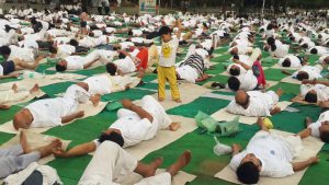 A child strikes a pose of his own during a Yoga Day session at Dwarka Park in New Delhi