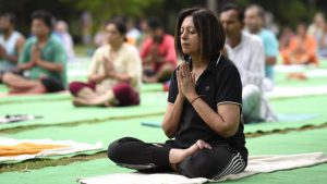 A large group performs yoga at Lodhi Garden in New Delhi on June 18, 2017.