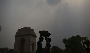 Boys work as daily wage labourers in the lawns of India Gate, in New Delhi.