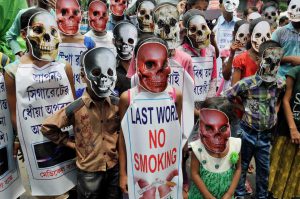 Children wear mask during an awareness campaign on 'World No Tobacco Day' in Kolkata on Wednesday.