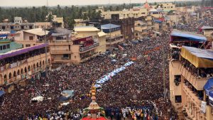 Devotees gather in the street at Bada Danda in Puri to witness the grand ceremonial procession during Rath Yatra festival. The festival commemorates Lord Jagannath’s annual visit to Gundicha Temple